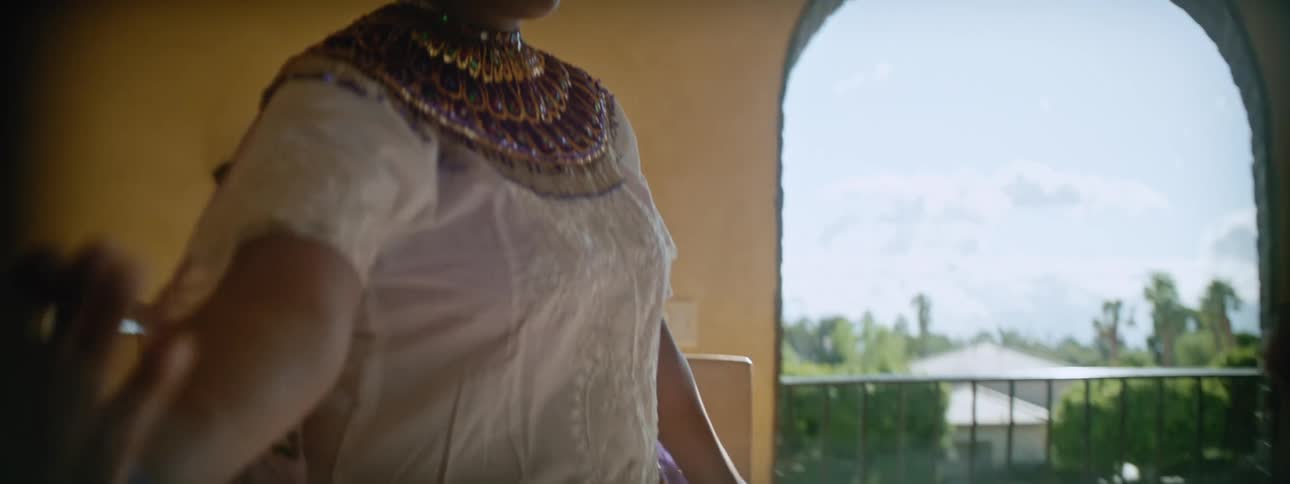Mother teaches her daughter traditional dances on the living room at home