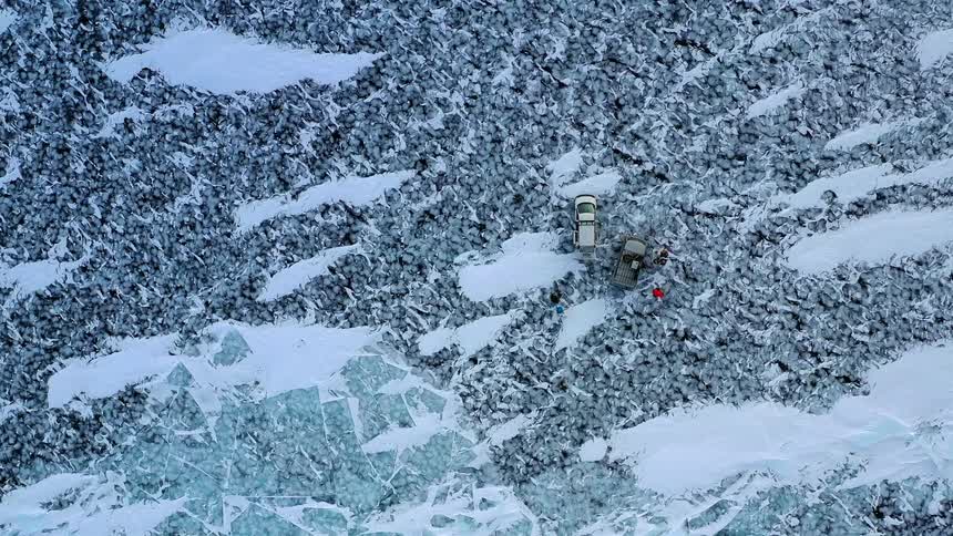 A person walks over the ice