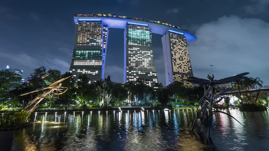 Time lapse of colorful lights on the facade of the emblematic Marina Bay Sands hotel in Singapore