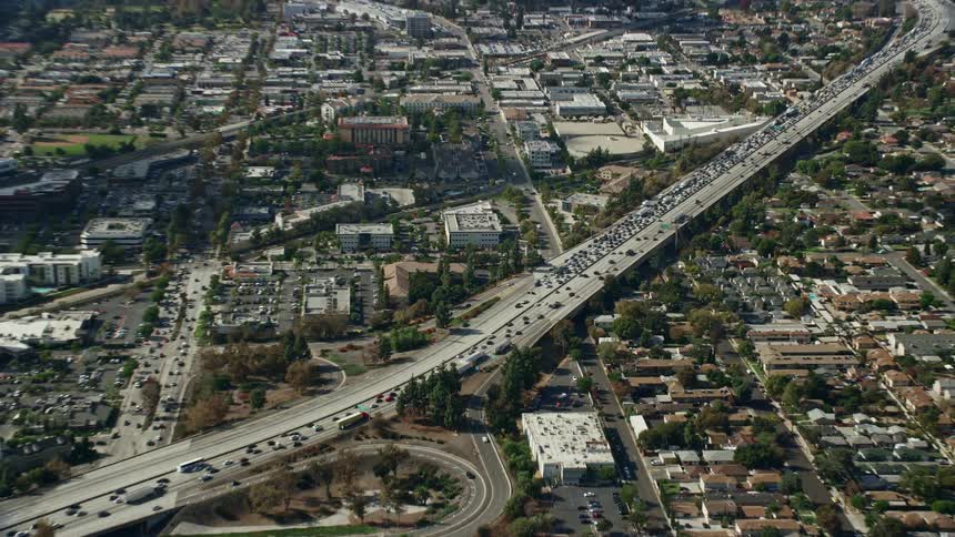 CHP stops traffic on 210 Freeway in Arcadia California during rush hour amidst heavy traffic congestion