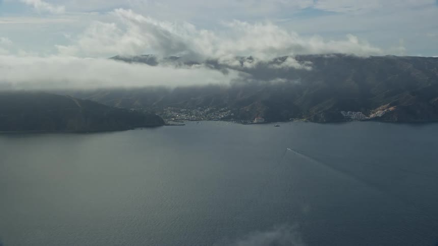 A breathtaking view of low clouds covering Avalon Catalina Island California seen from an aerial view