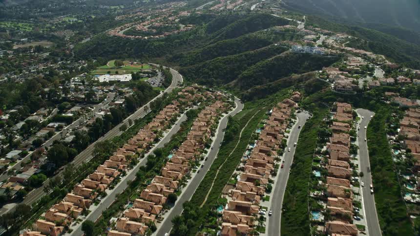 Aerial view of hillside homes in Laguna Niguel California with sunny weather and a clear blue sky