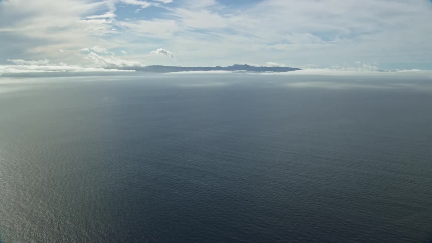 Approaching the picturesque Catalina Islands on a partly cloudy day with stunning views of Santa Catalina Island shot from a helicopter using a Shotover F1 camera
