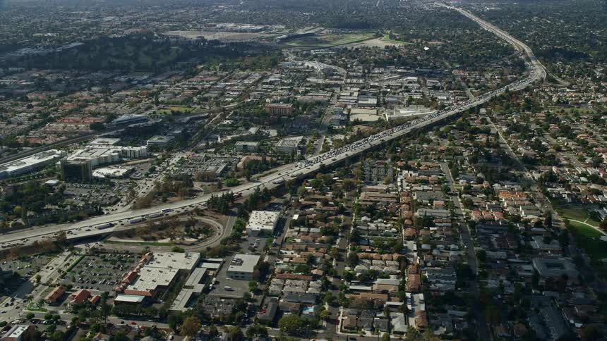 Aerial view of CHP stopping traffic on 210 Freeway in Arcadia during rush hour traffic