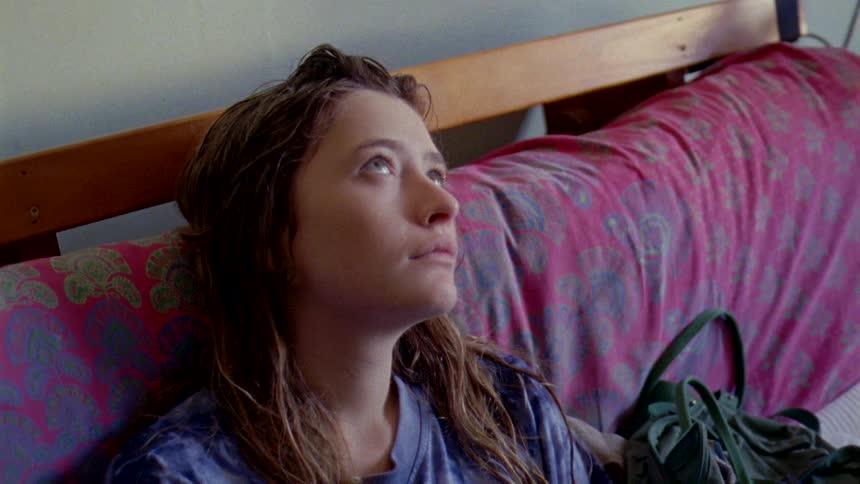 A woman is resting as she sits