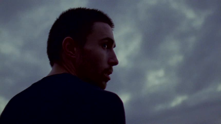 A man looks over his shoulder