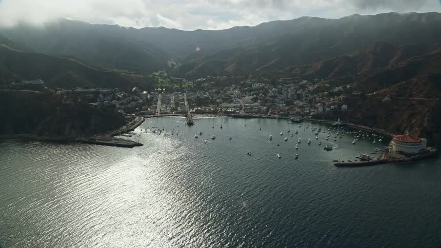 A breathtaking aerial view of Avalon Bay Catalina Island California showcasing the town nestled in the midst of the mountains and the bay