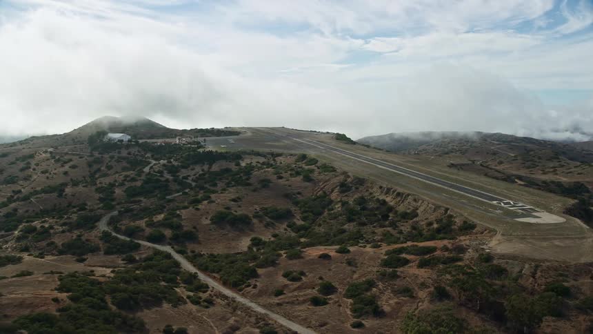 Approaching the Catalina Airport runway on a partly cloudy day over Santa Catalina Island in Southern California