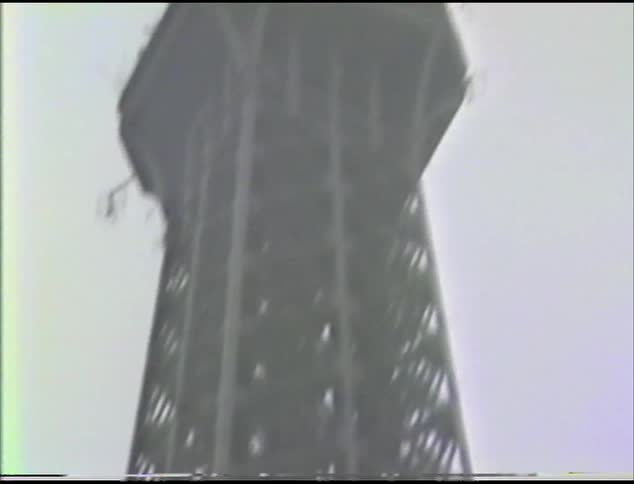 A tower under a pale sky on a snowy day