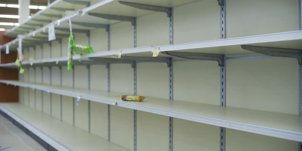 Shelves are empty in a grocery store