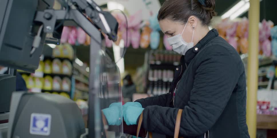 A woman grabbing cash from her purse