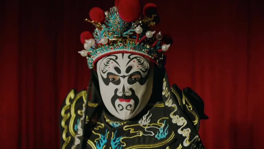 Someone is dressed up as a clown on stage