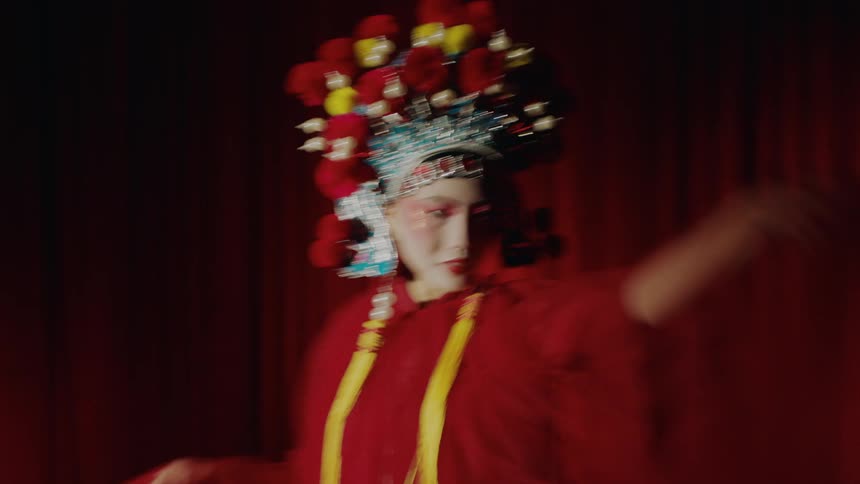 A woman is dancing on stage