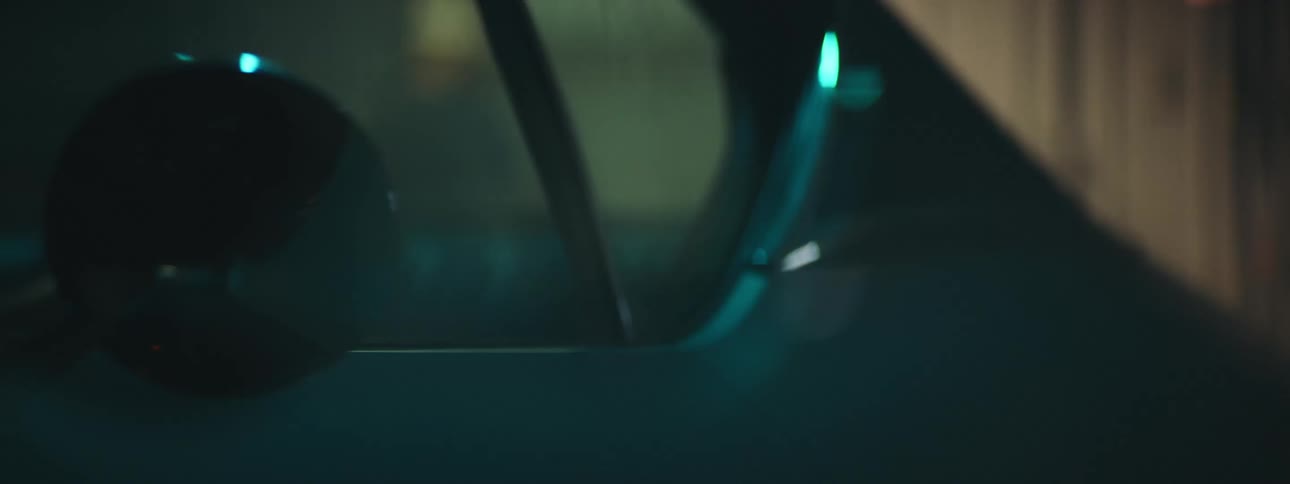 Close up of bright blue lights flashing over the shiny body of a sports vehicle