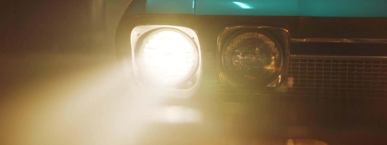 The view is of car that is driving at night time