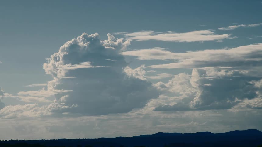 Clouds move from left to right across the horizon