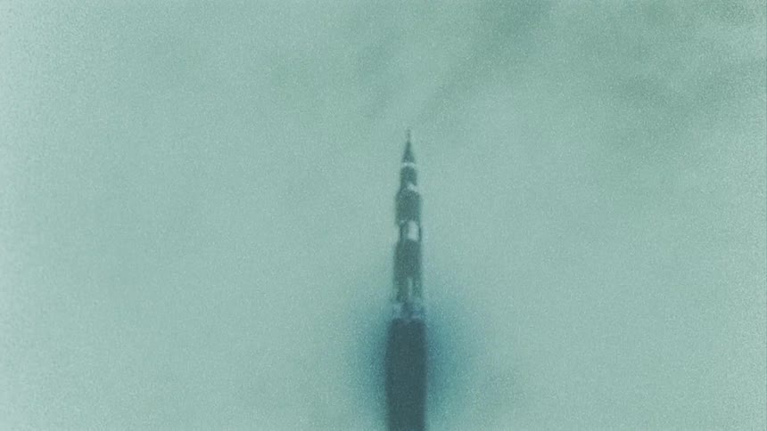 Rocket climbs through cloudy sky during launch