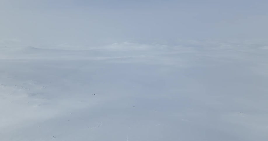 An aerial landscape view of snow covered lands