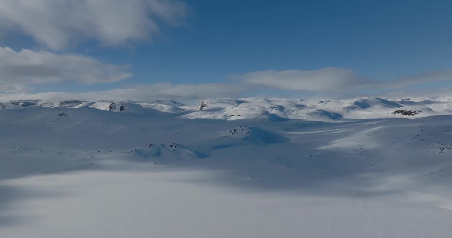 Aerial view of snow covered mountains are displayed