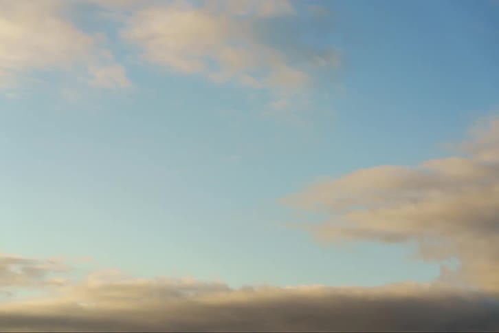 The view is of the clouds and the sky in the day time