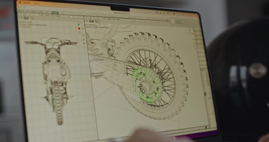 A laptop screen with a diagram on it as a person manipulates the image on the screen