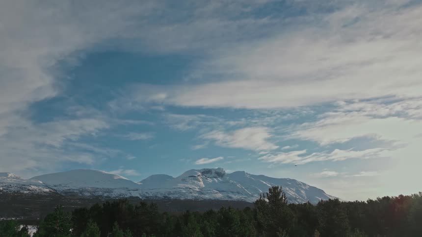 A mountain range in the horizon is displayed