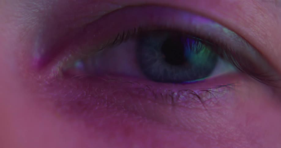 The light reflects in a persons blue eye