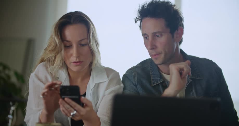 Two people are having a conversation together indoors