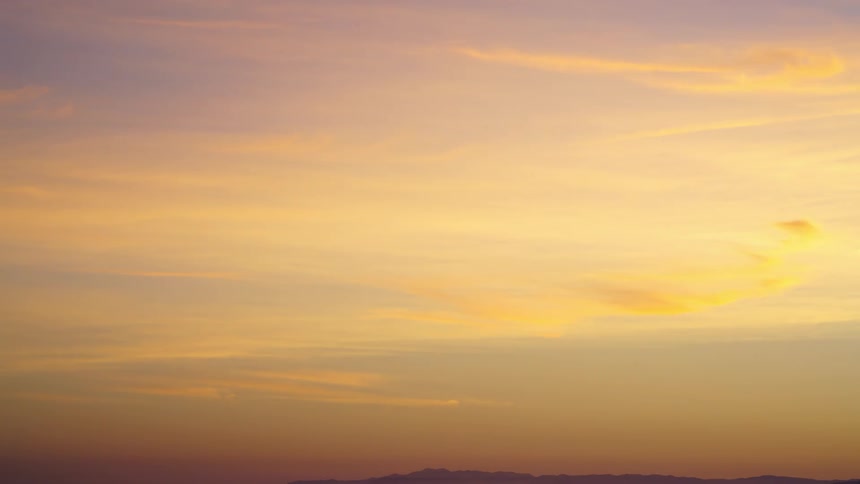 Time lapse view of the sun setting in the horizon