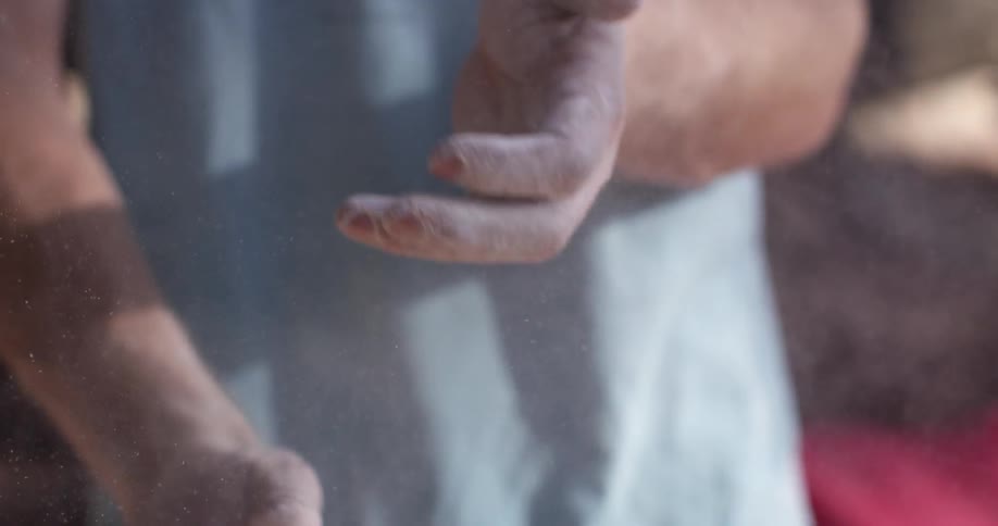 A man wipes his hands together