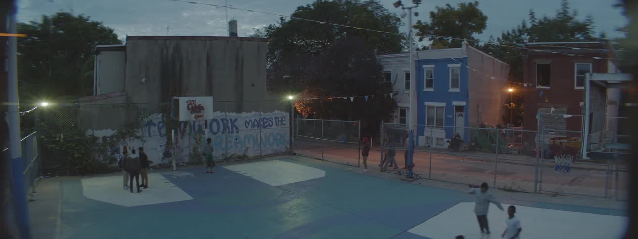 A group of kids playing basketball