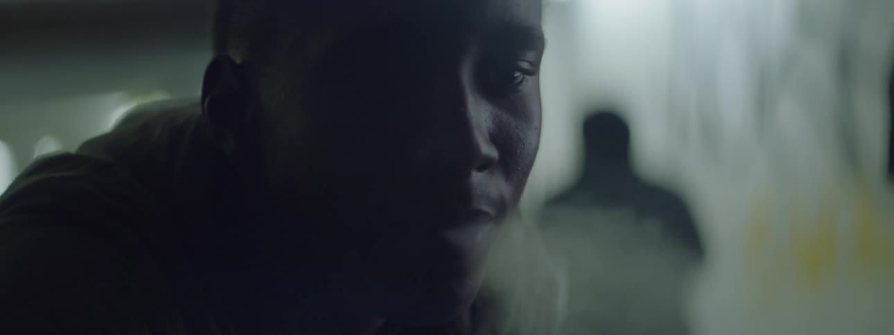 Close up of a man talking and smoking