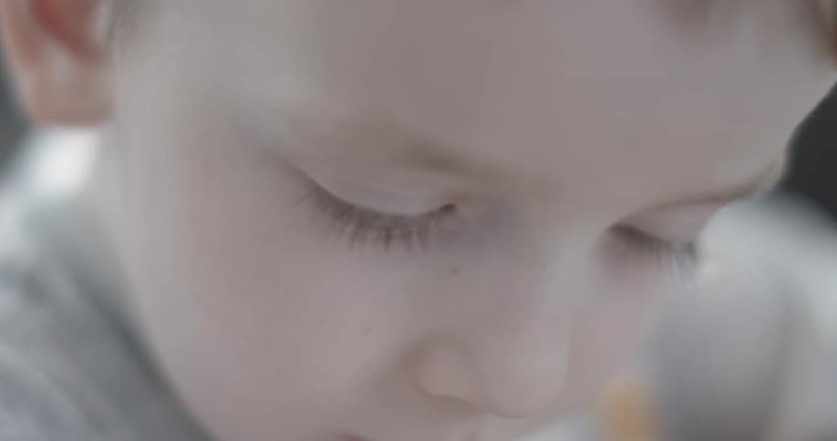 Close up of a child's face looking down