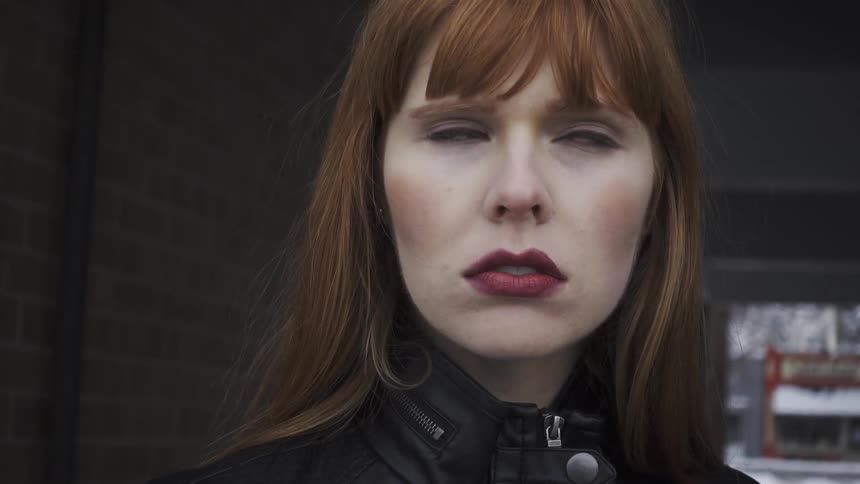 Close up of a woman's face looking disappointed