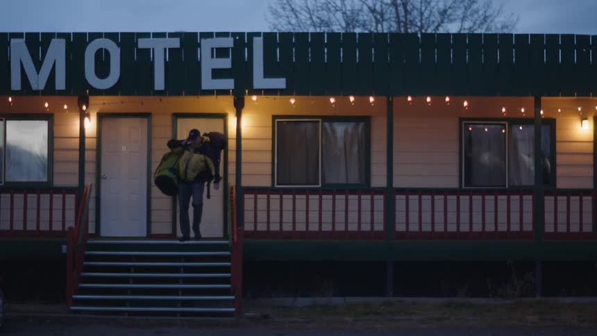 A man leaves the motel