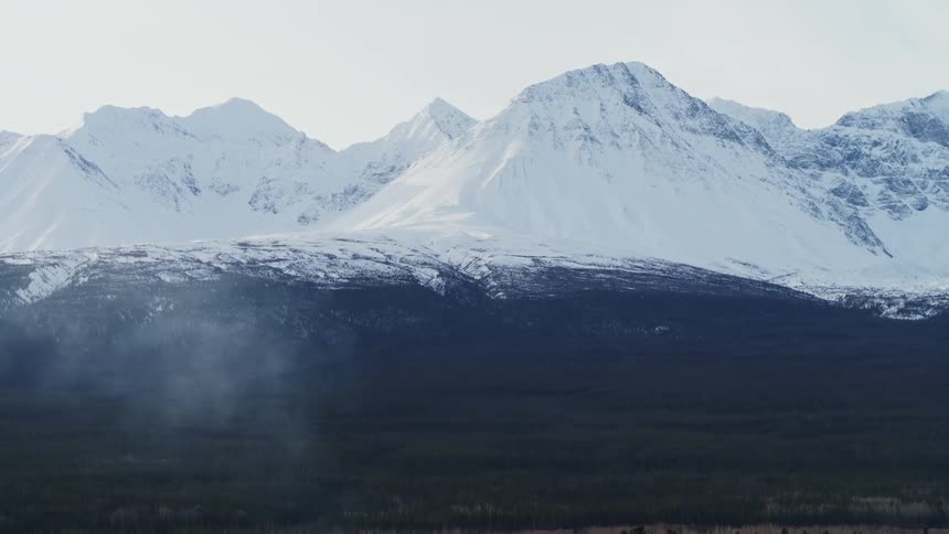 Snow covered mountain range landscape during the day