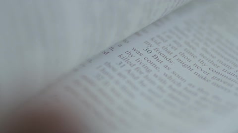 Close-up of pages being turned in a book