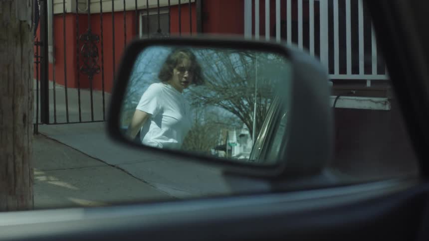 A woman gets out of the car