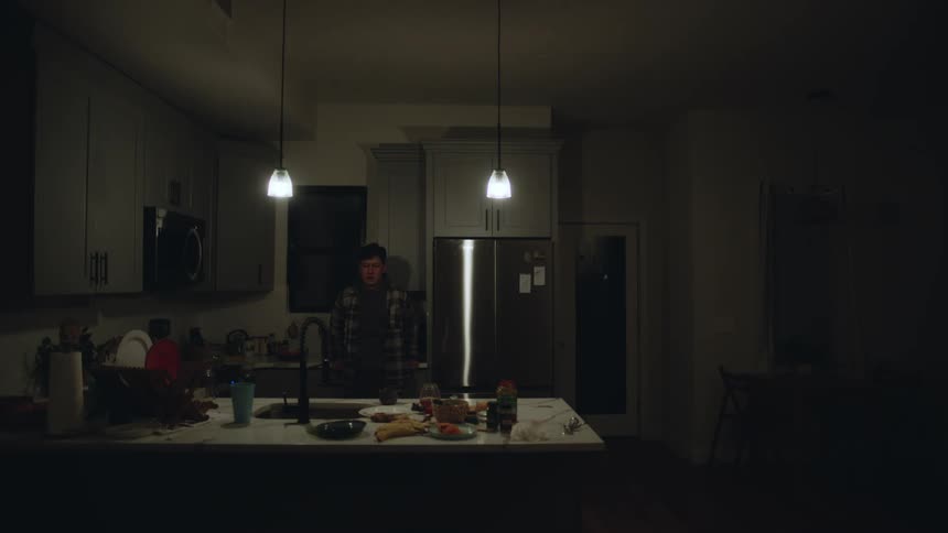 A man does dishes at home