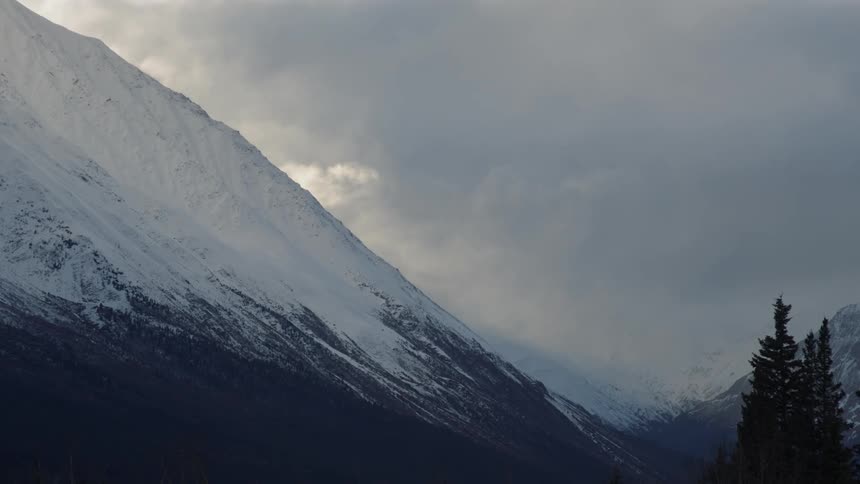 Aerial view of mountains during winter is displayed