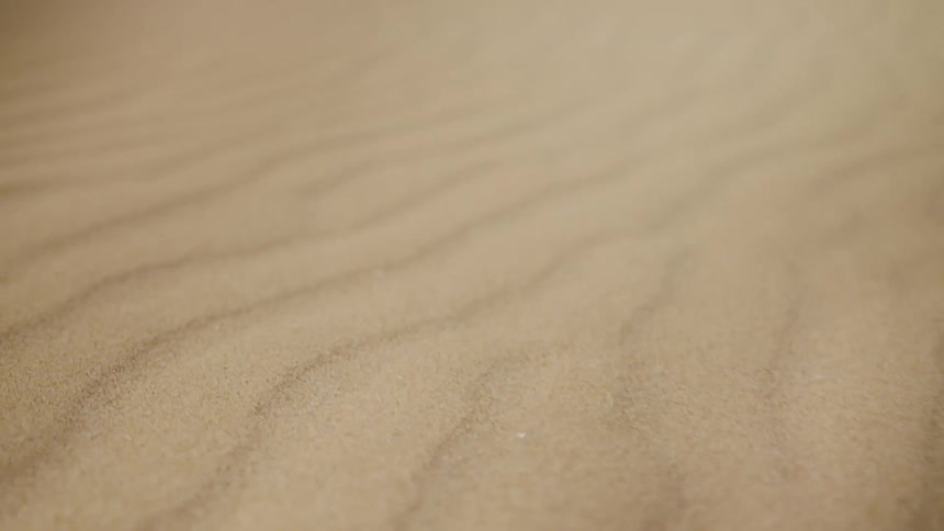 Sand forms wave pattern in desert and dunes