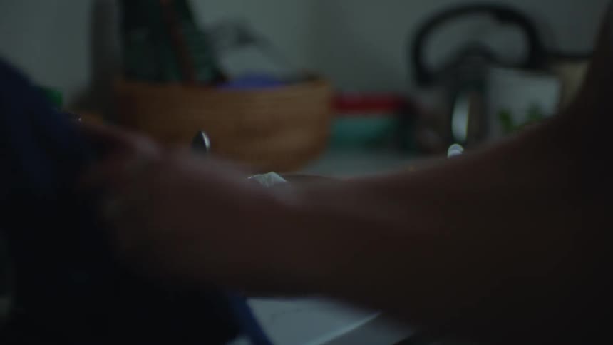 A woman is preparing a healthy meal for herself in her kitchen in the daytime