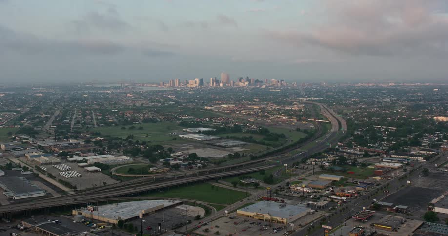 Aerial 4K footage of Downtown New Orleans skyline at sunrise shot from Gentilly during the summer