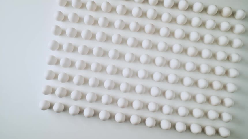 A grid of eggs on a white background