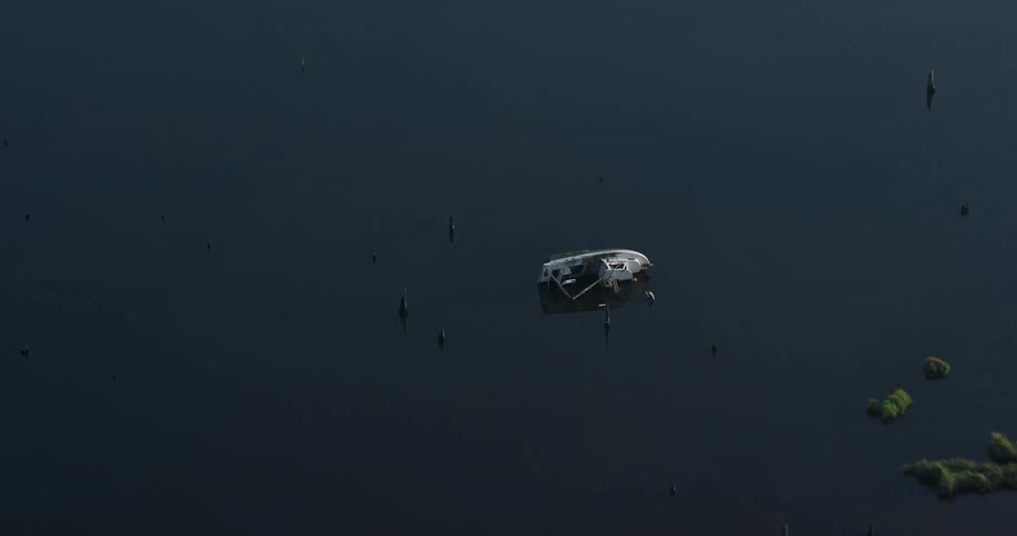 A 4K aerial view of a capsized fishing boat in the water at sunrise over St Bernard Parish Louisiana during the summer months