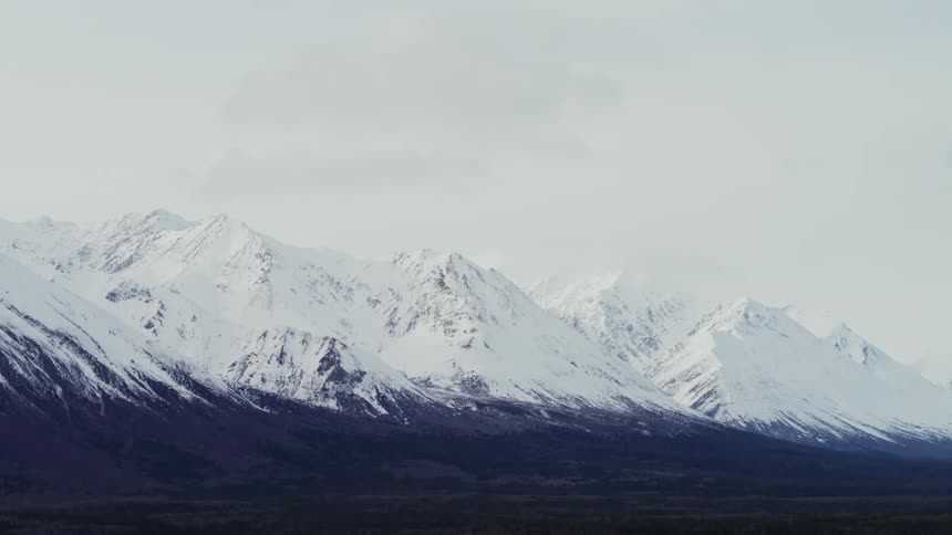 Landscape of snow capped mountain range