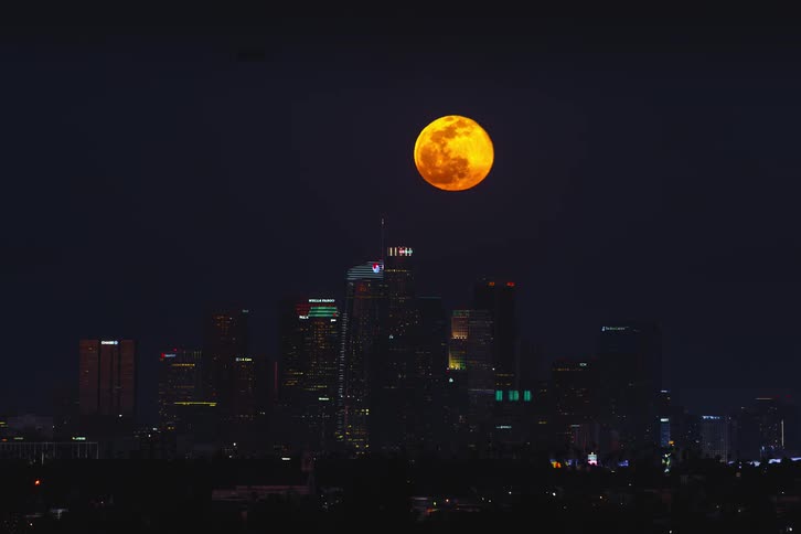 Time lapse view of the moon over Los Angeles during the night time