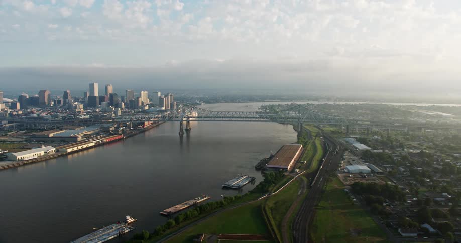 A stunning 4K aerial footage capturing Crescent City Connection Bridge at sunrise over the Mississippi River in New Orleans Louisiana