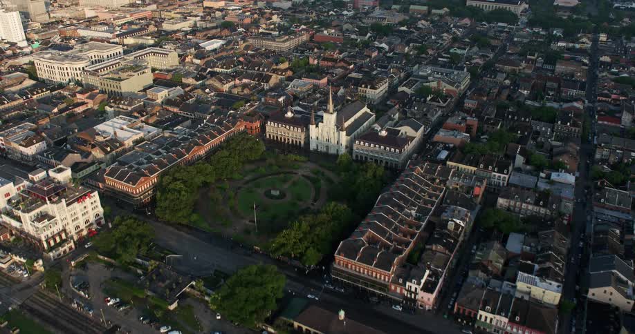 An aerial flyover of St Louis Cathedral and Jackson Square at sunrise in the French Quarter of New Orleans Louisiana