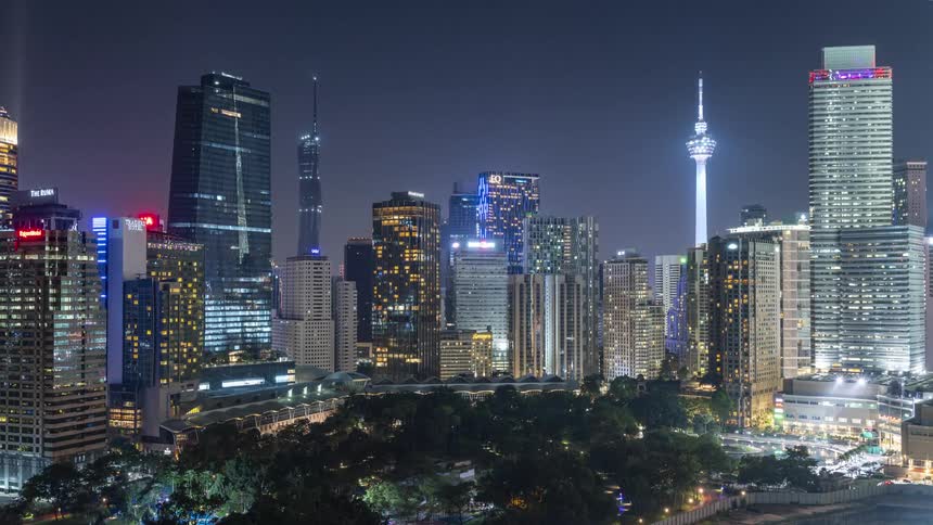 Brightly illuminated city skyline of Kuala Lumpur at night